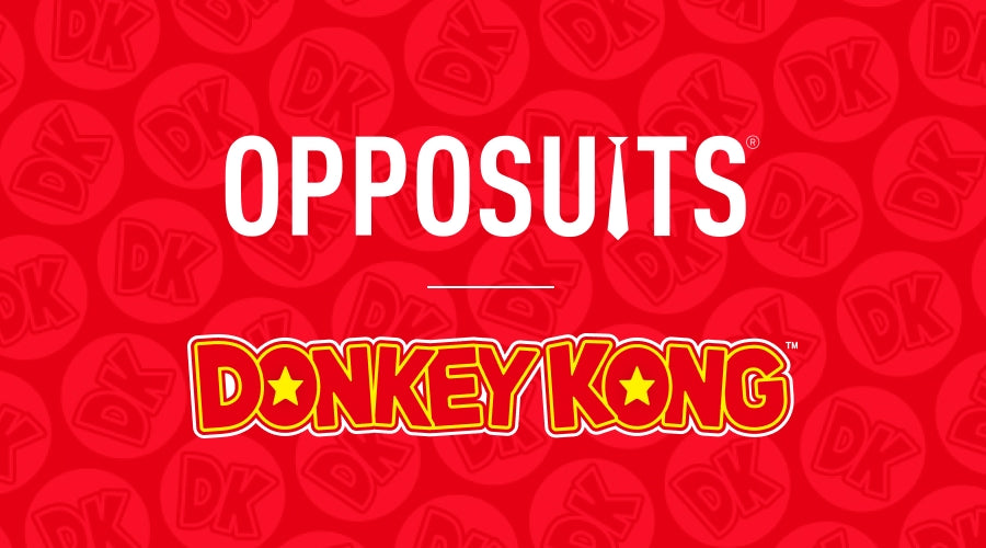 A red graphic with a repeating dark red circular pattern in the background, featuring the word 'OPPOSUITS' in large white letters and 'DONKEYKONG' in yellow outlined lettering below it.