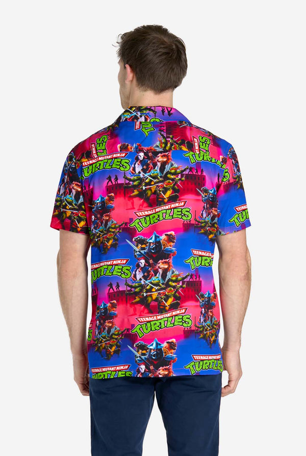 Man wearing Hawaiian Shirt with Teenage Mutant Ninja Turtle print.