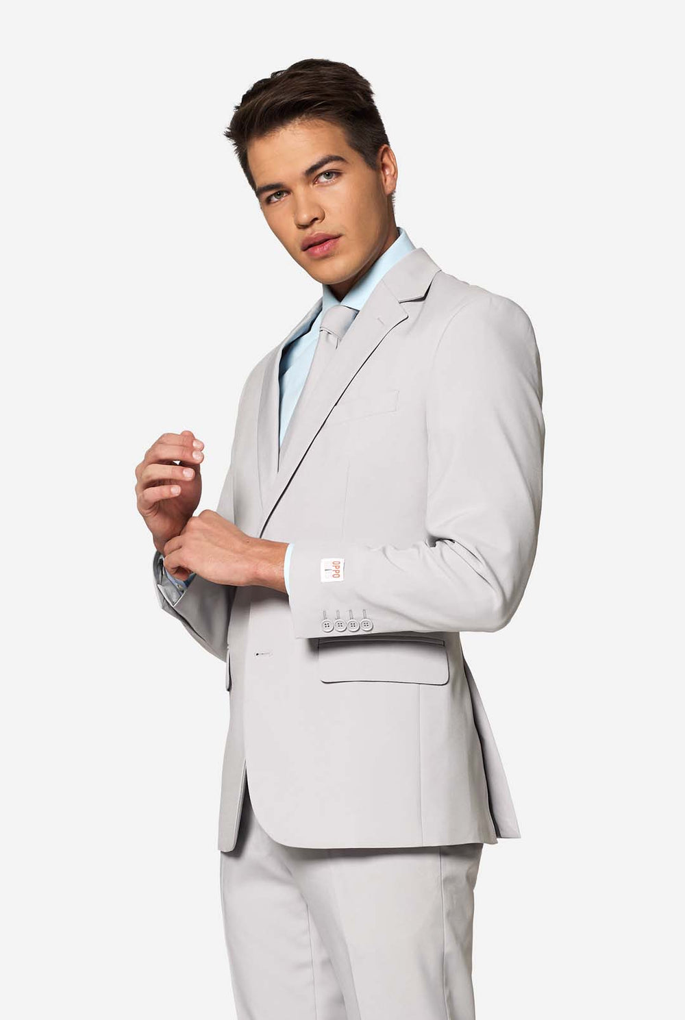 Solid color light grey men's suit Groovy Grey worn by man. Upper body image.