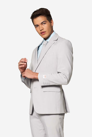 Solid color light grey men's suit Groovy Grey worn by man. Upper body image.