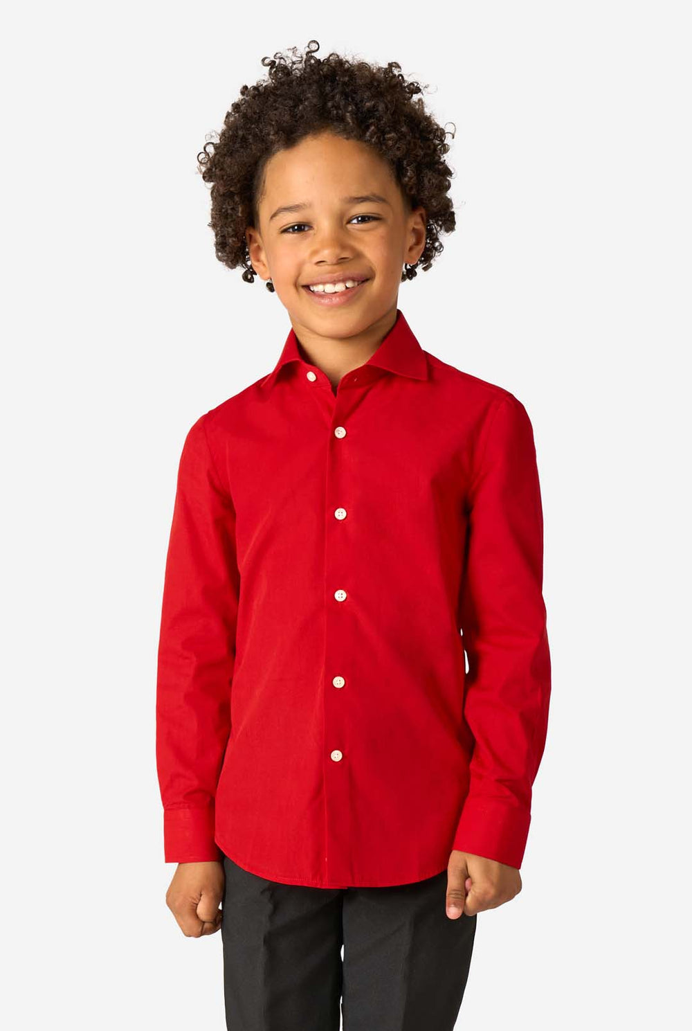 Little kid is wearing a red shirt and black pants.