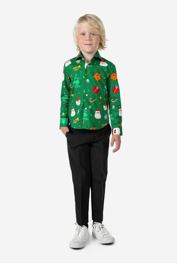 Child wearing a festive green shirt with Christmas patterns on a white background