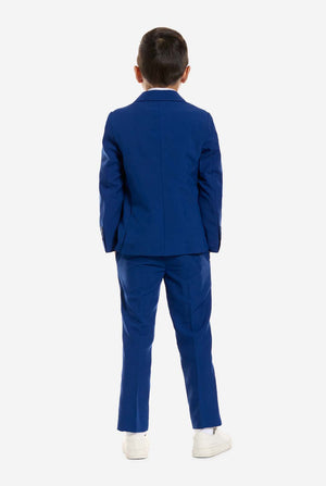 Child wearing a blue suit on a white background, view from the back.
