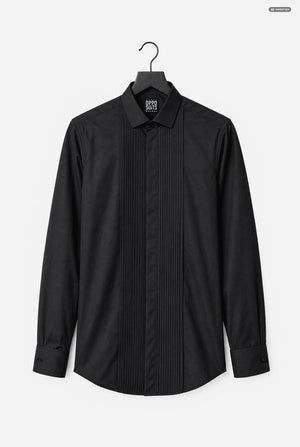 A black long-sleeve tuxedo shirt with vertical pleats down the front, hanging on a black hanger against a light gray background.
