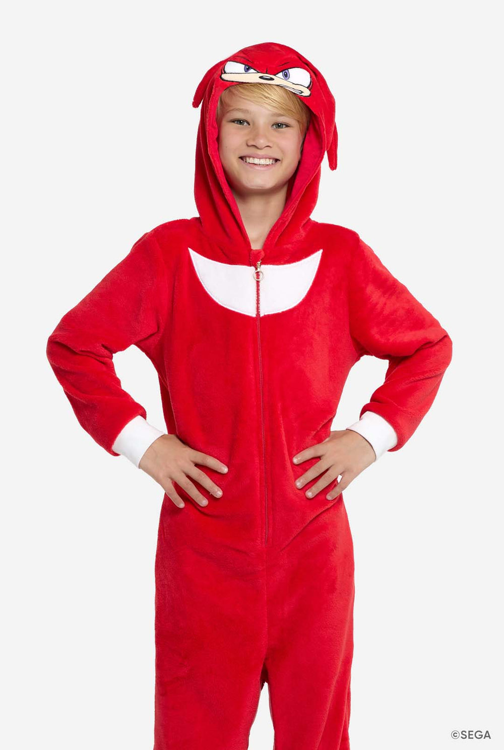 Child wearing a red Knuckles onesie with a hood on a white background