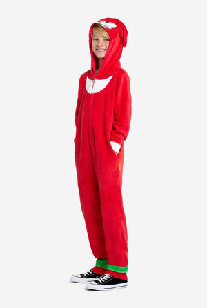 Person wearing a red Knuckles onesie with a hood on a white background. Full body image