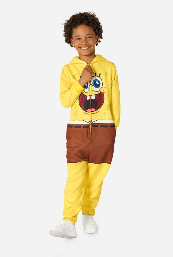 Child wearing a yellow SpongeBob onesie with a white background