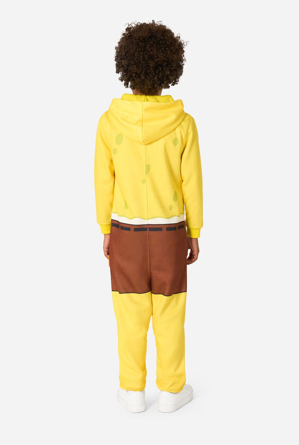 Person wearing a yellow onesie and brown pants on a white background. View from the back