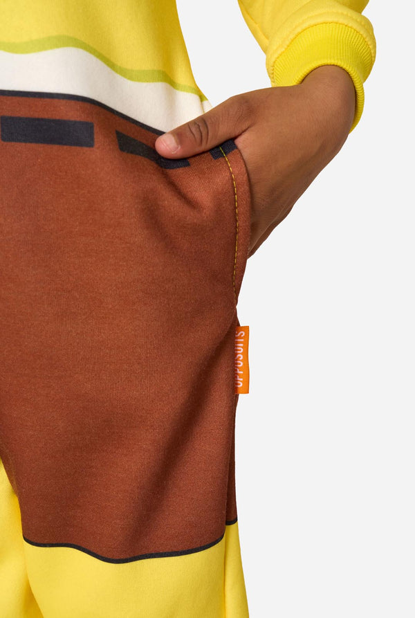Close-up of a person wearing a brown and yellow Spongebob onesie with a visible brand tag.