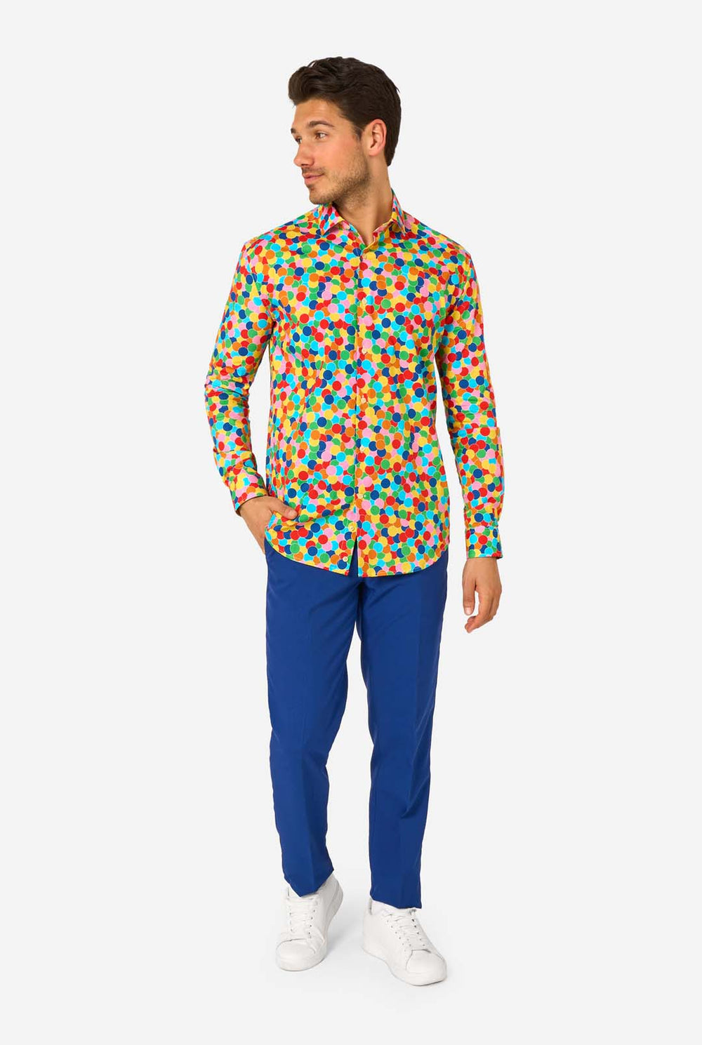 Man wearing a colorful polka dot confetti shirt on a white background