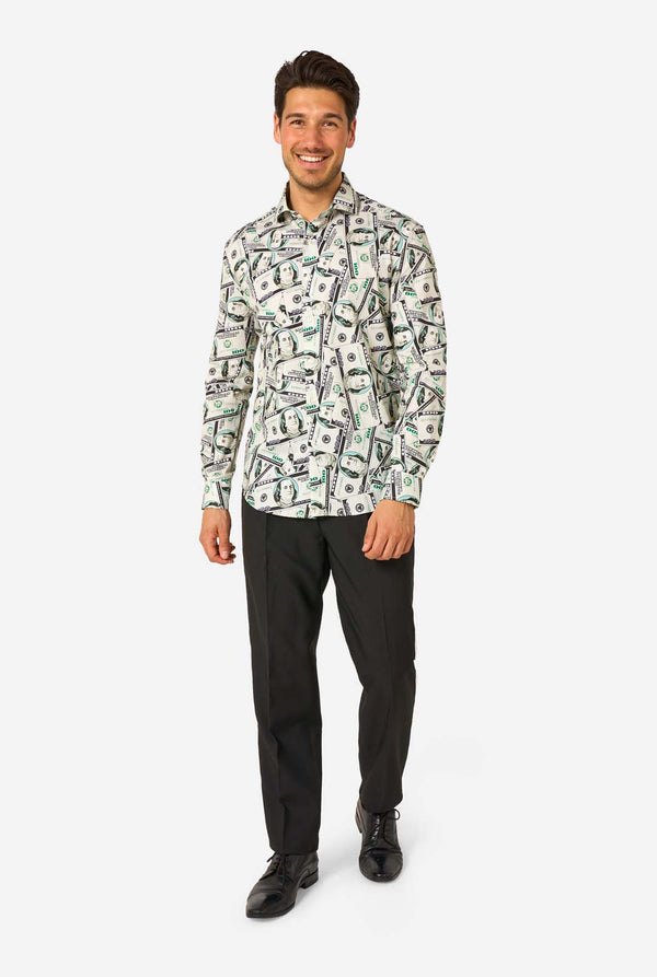 Man wearing a dollar-patterned shirt and black pants on a white background