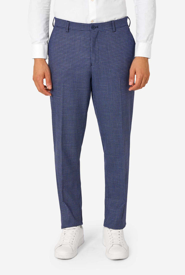 Blue checkered pants worn by a person on a white background