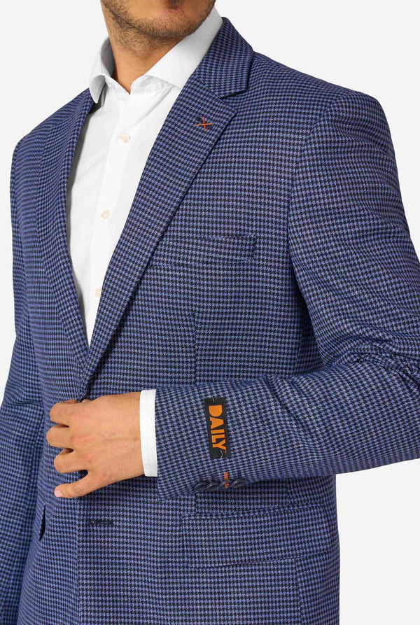 Blue checkered suit jacket worn by a person on a white background