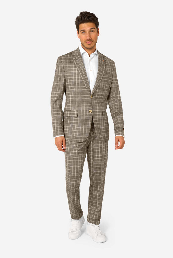 Man wearing a brown checkered suit with a white shirt on a white background
