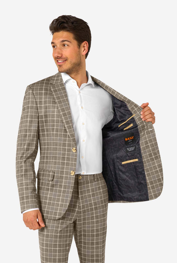 Man wearing a checkered suit with the DAILY logo on a white background
