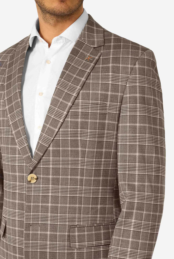 Brown checkered suit jacket worn by a person on a white background