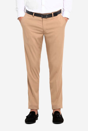 Beige pants worn by a person on a white background