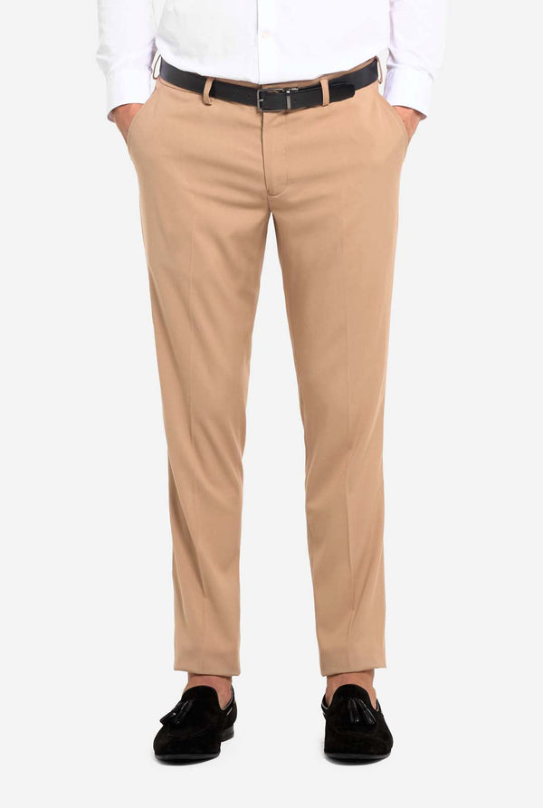 Beige pants worn by a person on a white background