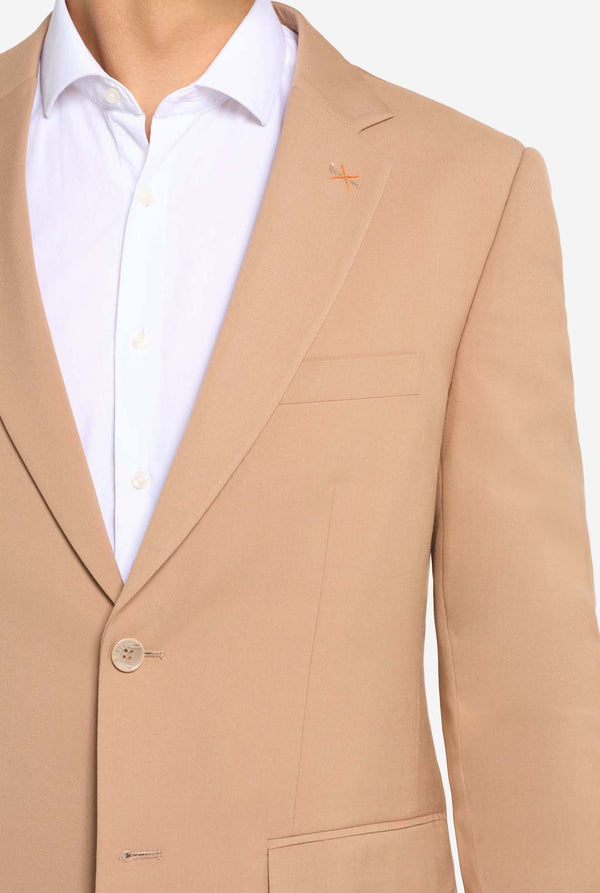Beige suit jacket with a white shirt on a white background