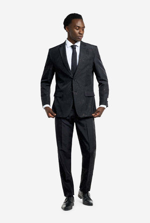 Image of a man wearing an OppoSuits Glitzy Glitter men's suit with glitters and white men's shirt. Suit consist of pants, jacket and tie. Full body image.