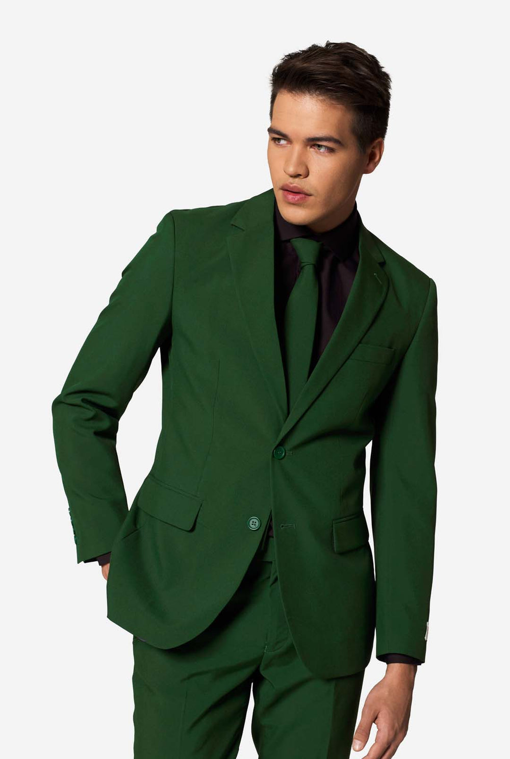 Stylish man wearing OppoSuits Glorious Green slim fit suit with black dress shirt and matching green tie — modern men’s formal wear.