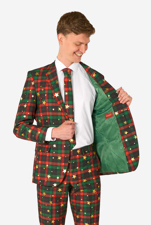 Man wearing a festive plaid suit with a white shirt and red tie.