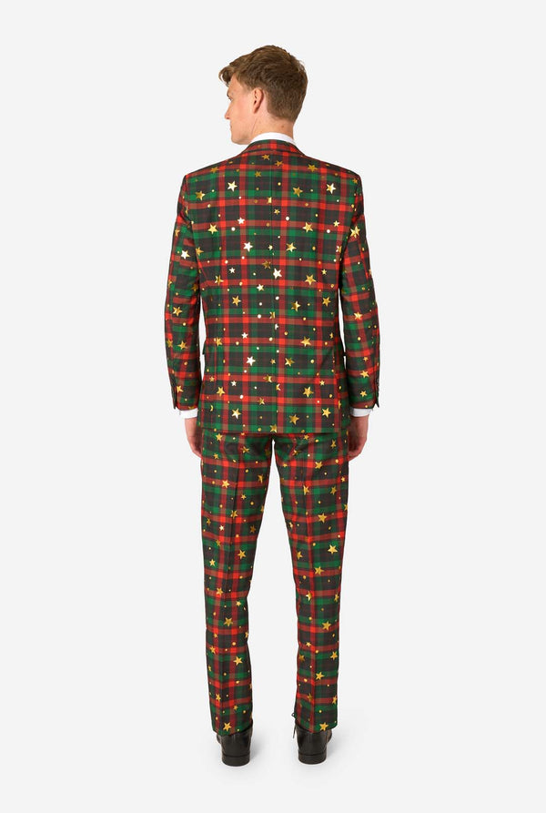 Person wearing a green and red plaid suit with star patterns on a white background