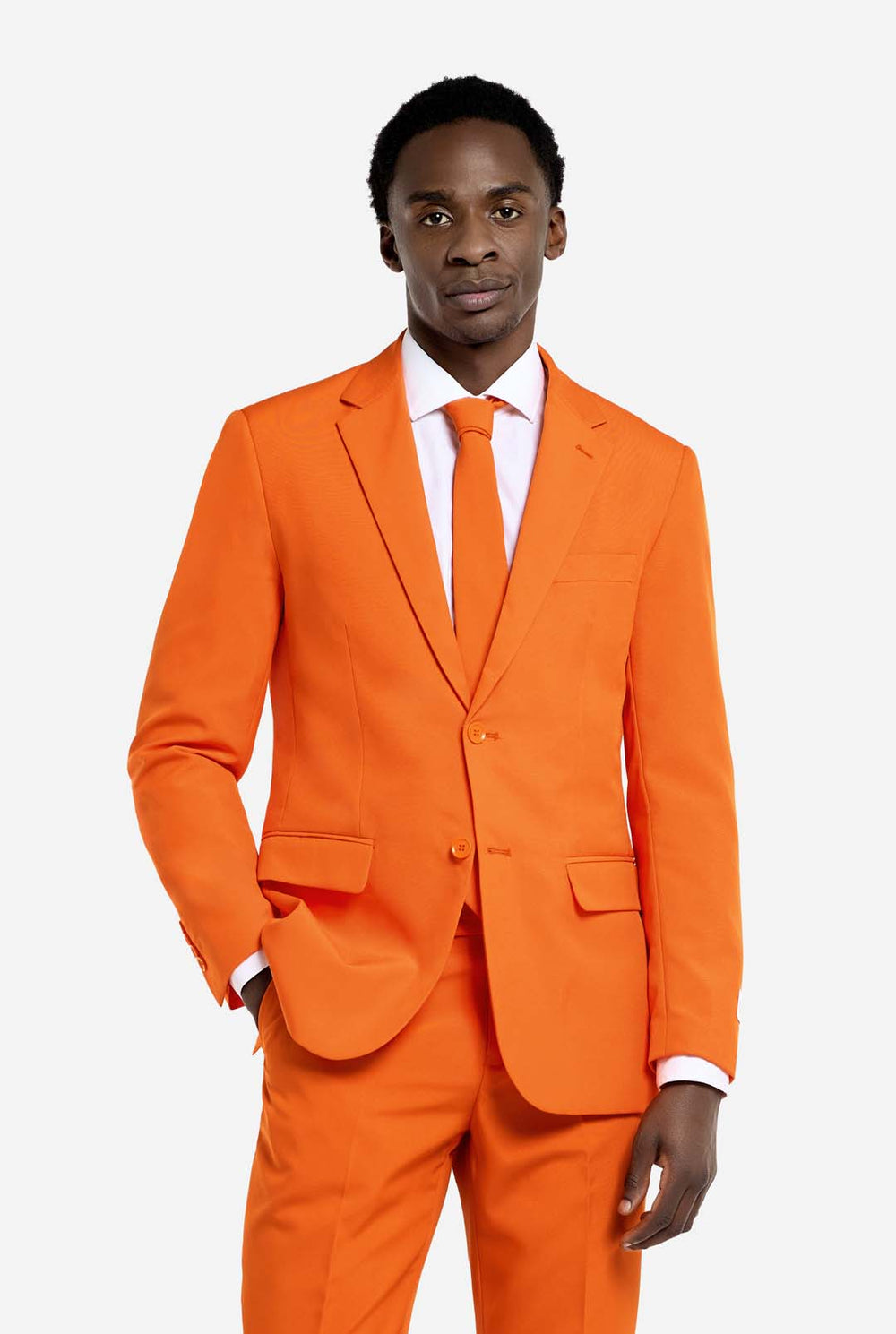 Man wearing an orange suit with a white shirt and tie on a plain background