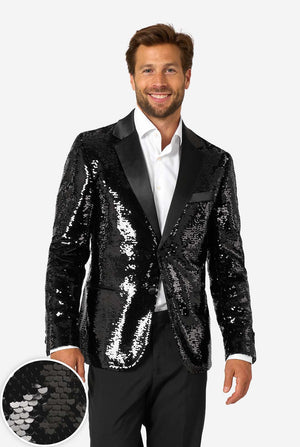 Man wearing a black sequin blazer over a white shirt on a white background