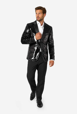 Man wearing a black sequin blazer on a white background