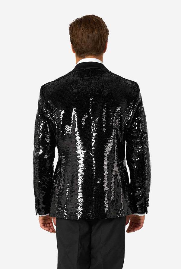 Black sequin jacket worn by a person on a white background