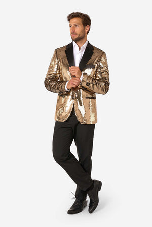 Man wearing a gold sequin blazer over a black tuxedo on a white background