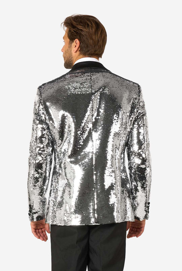 Man wearing a silver sequin jacket on a white background