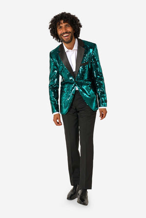 Man wearing a teal sequin jacket and black pants on a white background