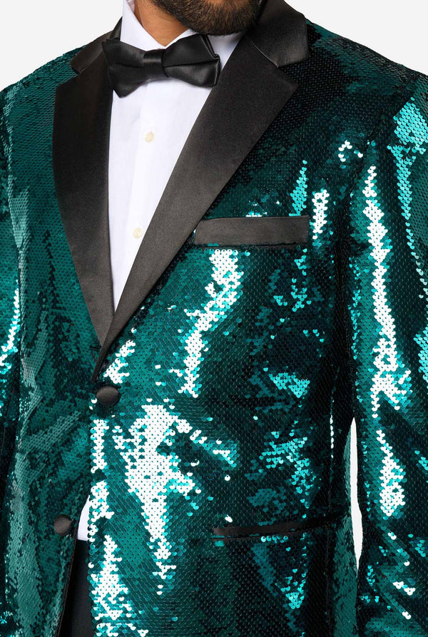Teal sequin tuxedo with black lapels and bow tie on a white background