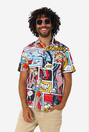 Man wearing a colorful comic-style shirt with sunglasses on a white background