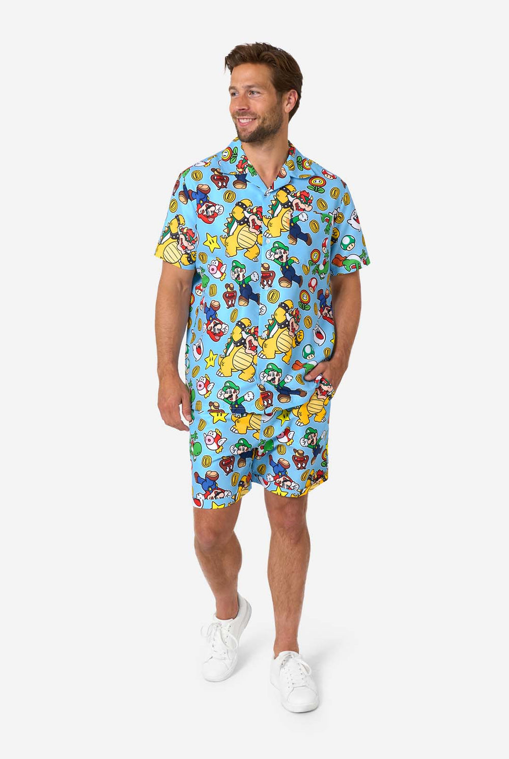 Man wearing a colorful Mario-themed shirt and shorts set on a white background