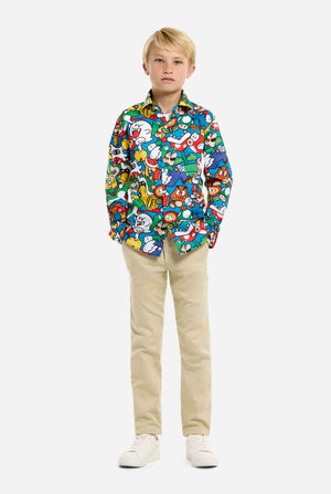 Image of teen wearing a Super Mario all over print shirt. Main color is blue, but there is also yellow, red and white. Full body image.