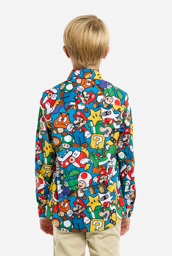 Image of teen wearing a Super Mario all over print shirt. Main color is blue, but there is also yellow, red and white. View from the back.
