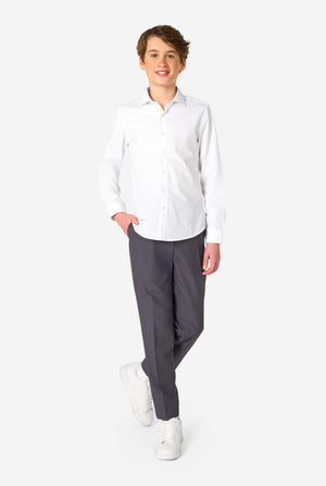 Image of long sleeve white shirt for boys worn by teen with hand in pocket. Also wearing black pants. Full body image.