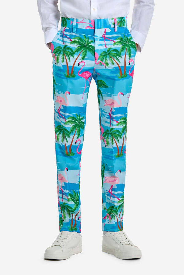 Colorful tropical-themed pants with flamingos and palm trees on a white background