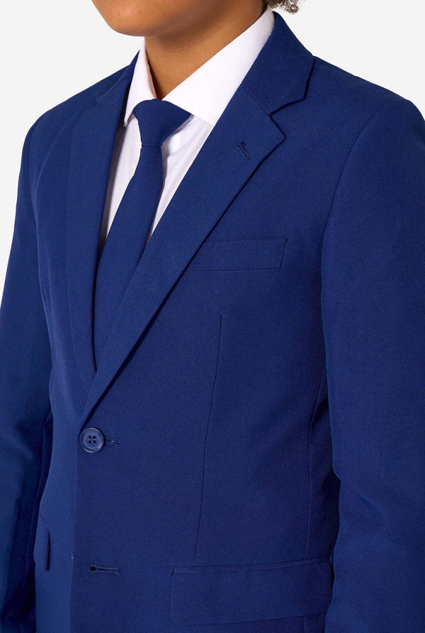 Blue suit jacket worn by a person on a white background