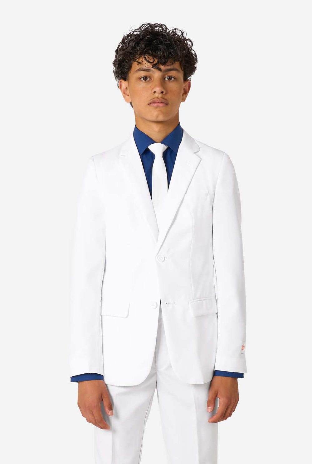 Kid wearing a white suit with a blue shirt on a white background