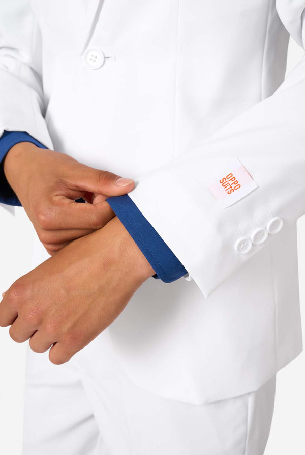 Close-up of a white suit with blue cuffs and a logo on the chest pocket.