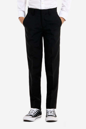 Person wearing black pants with a white shirt and black and white sneakers on a white background