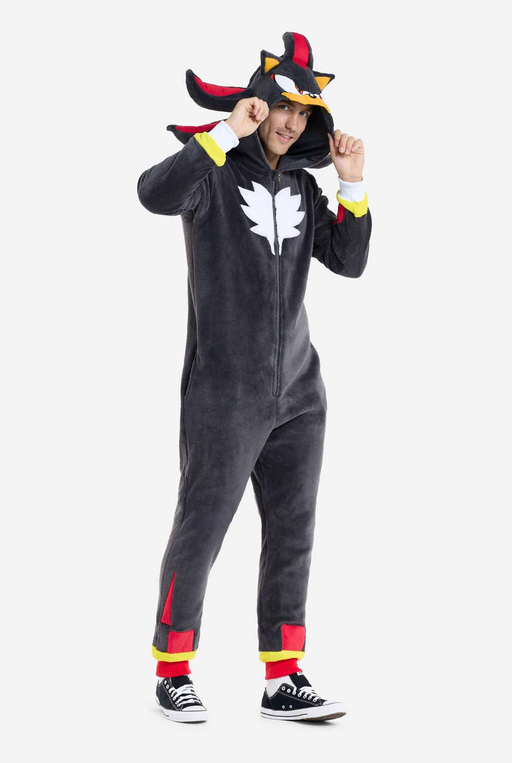 Person wearing a black Shadow onesie with a sonic character design on a white background