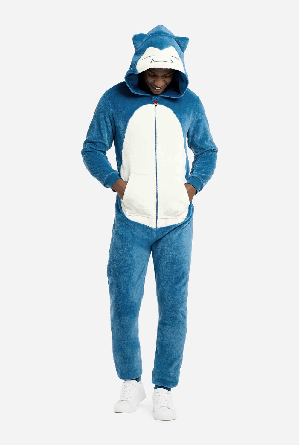 Person wearing a blue and white Snorlax onesie with cat ears on a light gray background
