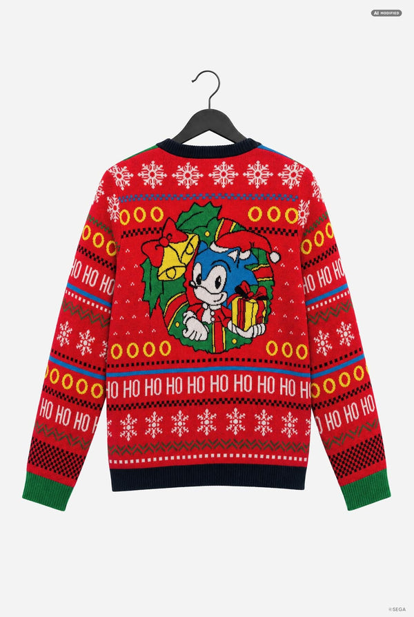 A red Christmas sweater featuring Sonic the Hedgehog on the front, hanging on a black hanger against a light gray background.