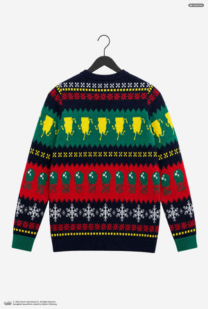 A long-sleeve knit sweater shown from the back, hanging on a black hanger against a light gray background. The sweater features a festive multicolor holiday pattern with rows of yellow Christmas trees, green ornaments, red snowflakes, and white snowflakes on a dark navy base.