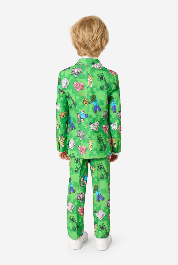 Child wearing a green suit with Minecraft character print on a white background
